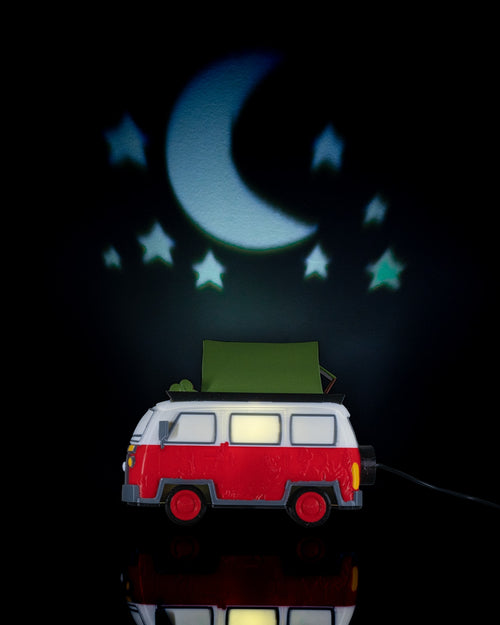 Toy van with a green roof under a crescent moon and stars projection on a dark background. Camping bus table lamp glowing retro van night light unique bedroom decor travel lover gift adventurer home decor