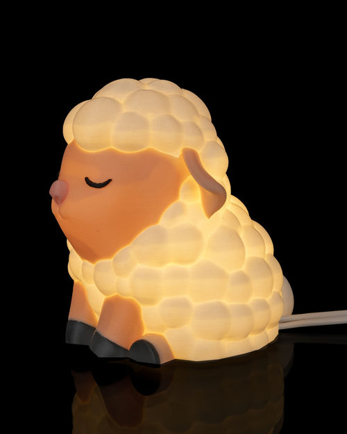 Sheep-shaped night light on a black background Counting sheep table lamp soft warm glow whimsical sheep design night light